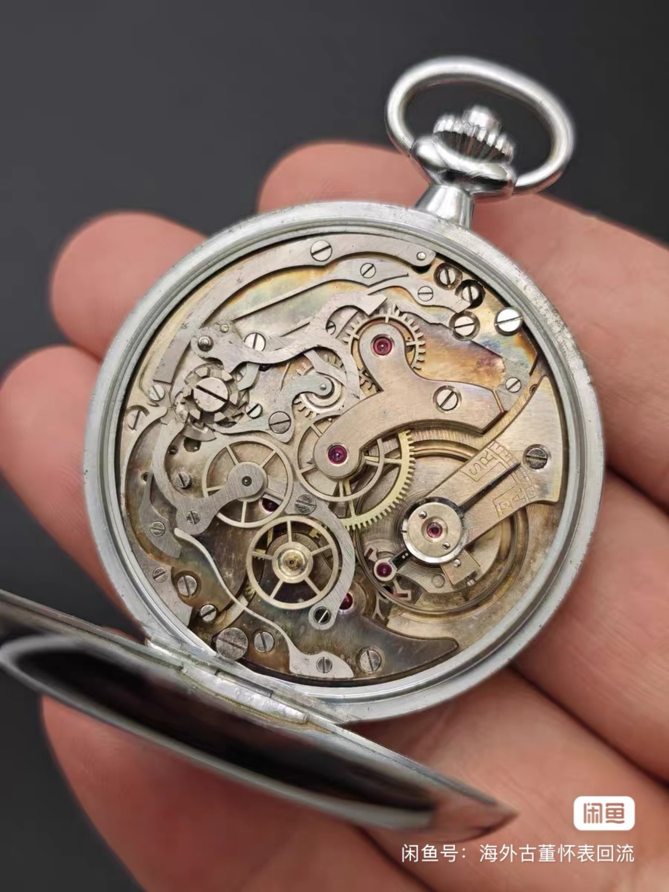 Open Berna pocket watch showing its mechanical movement