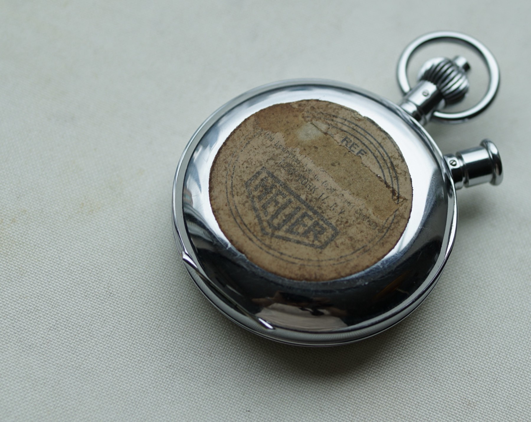 Heuer Ref. 11.204 pocket chronograph with its hinged caseback open