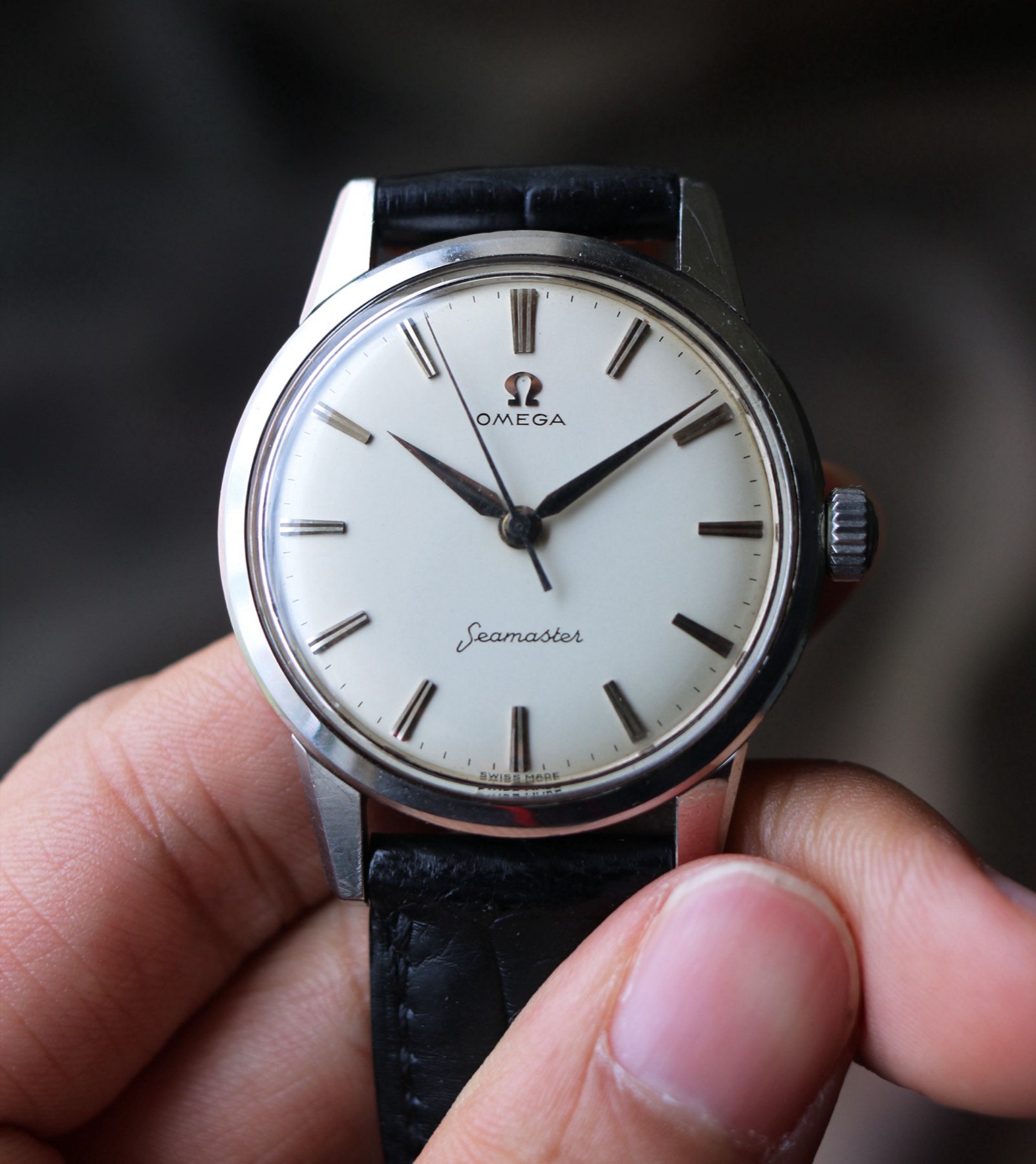 Close dial view of the Omega Seamaster showing the signature