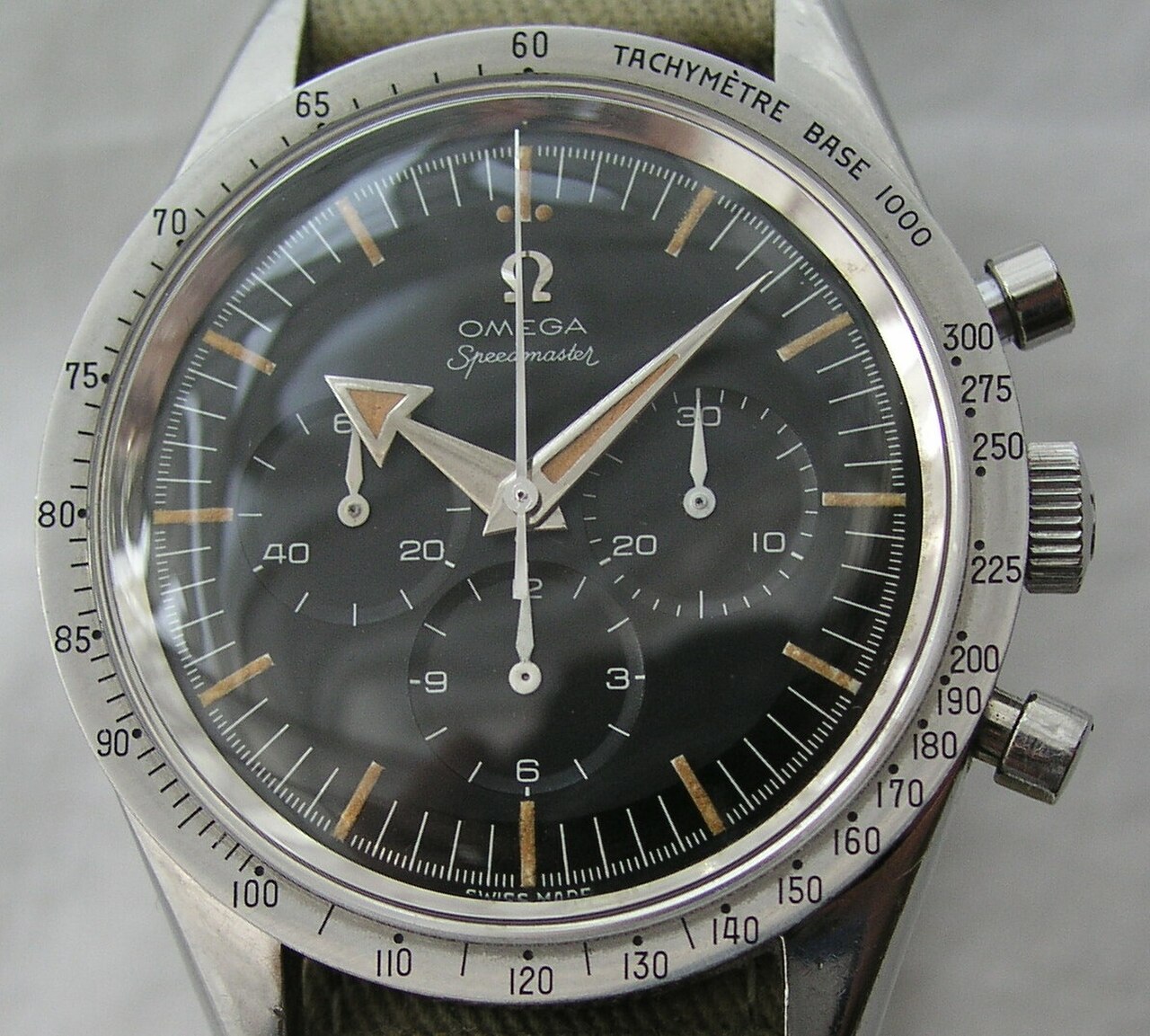 The first Omega Speedmaster, reference CK2915, with broad-arrow hands and a brushed steel bezel