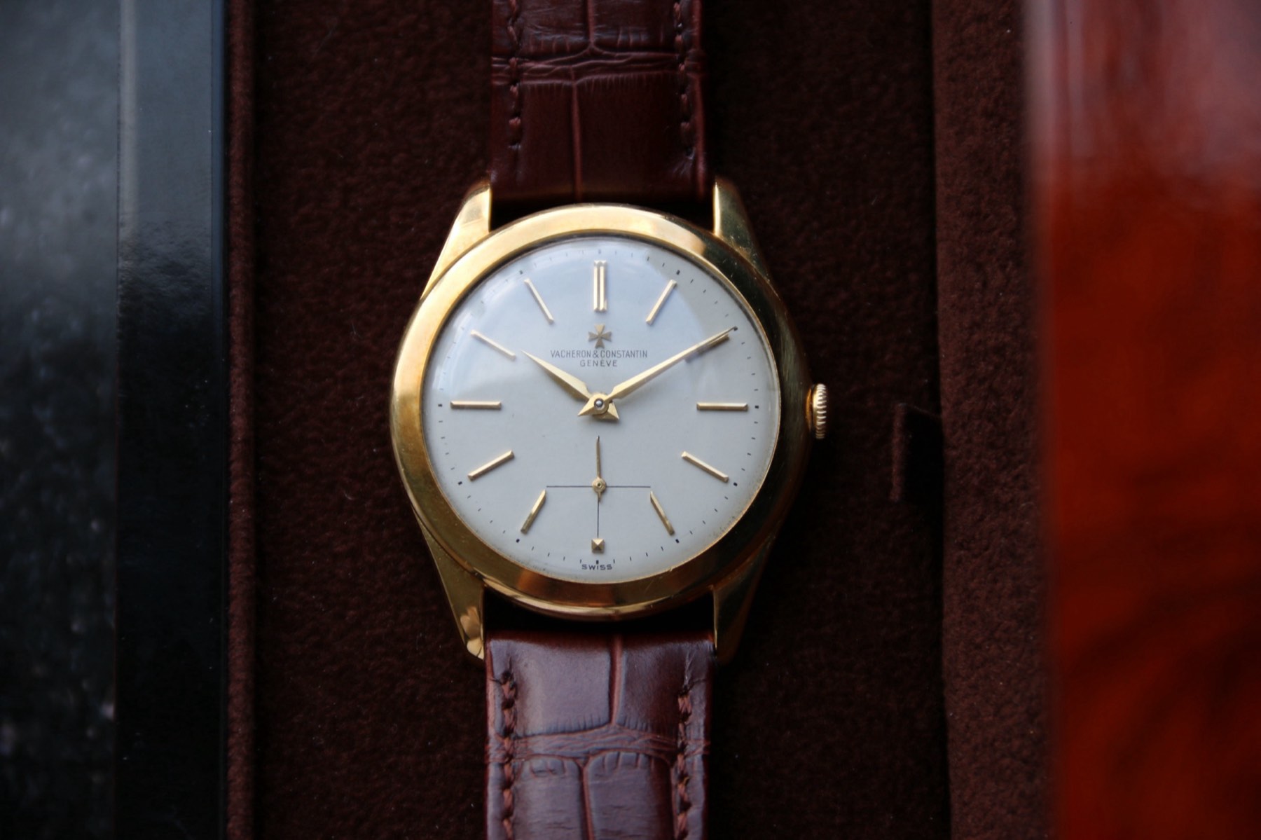 Vacheron Constantin Ref. 4600, circa 1957, shown from the front on a dark brown presentation surface