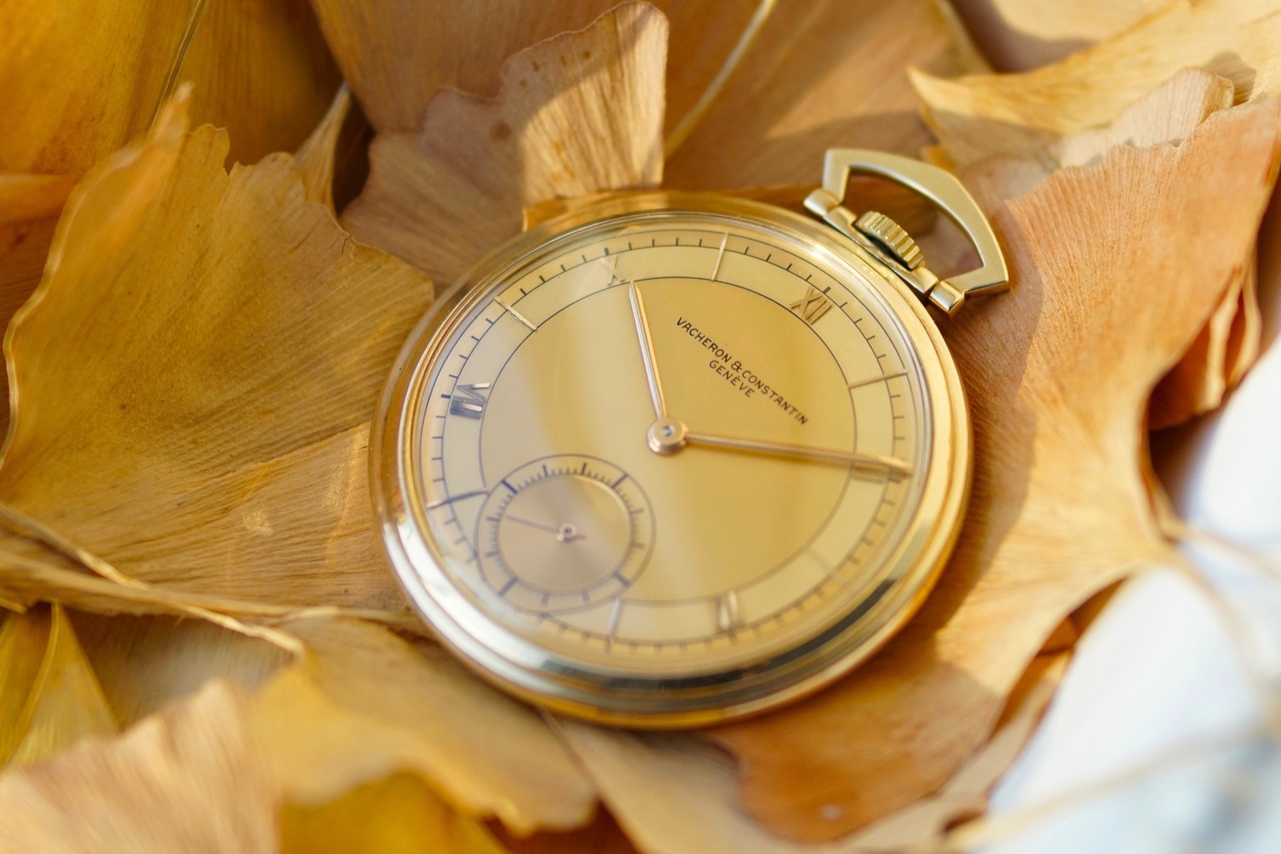Vacheron & Constantin pocket watch and chain arranged on handwritten archival paper