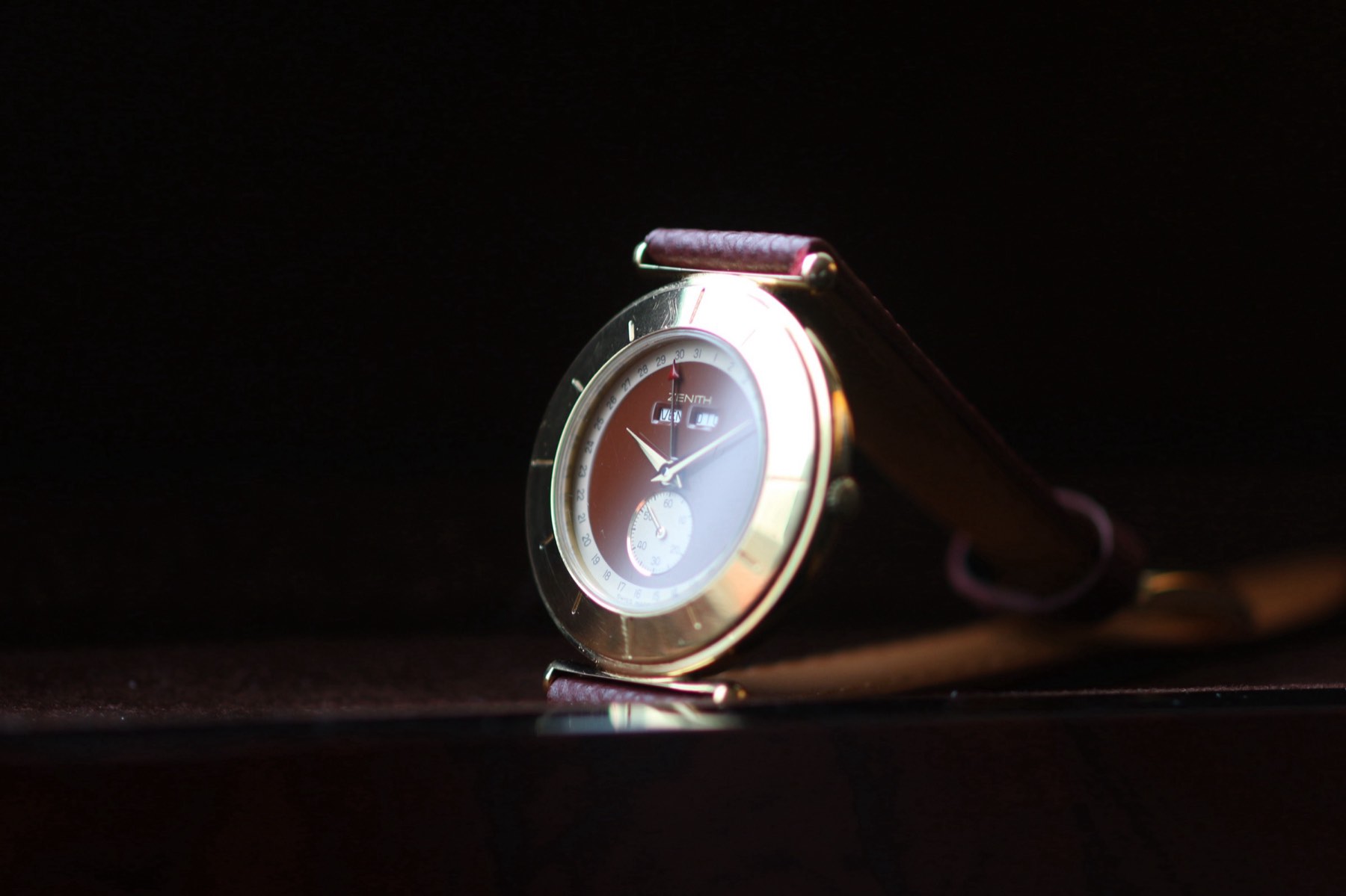 Zenith reference 27.0030.398 complete-calendar quartz dress watch photographed against a dark background