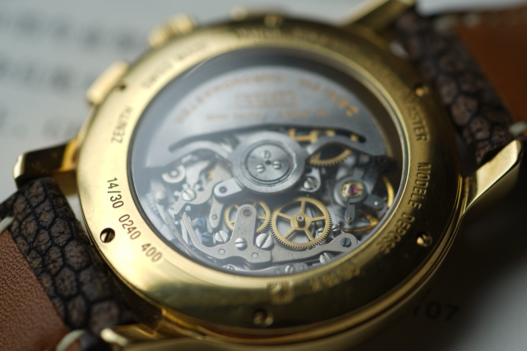 Gold Chronomaster case, stepped bezel, long lugs and rectangular pushers